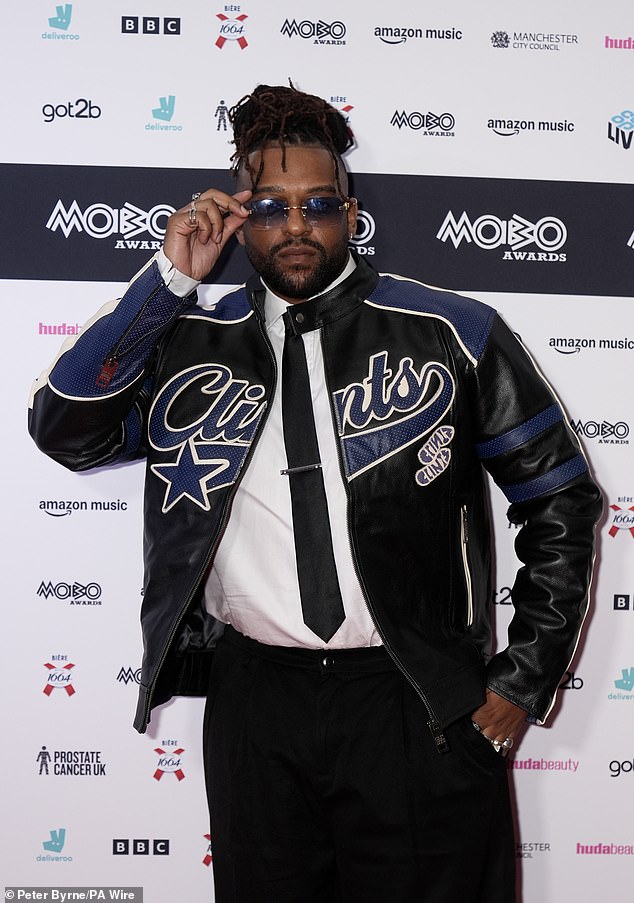 Oritse Williams cut a trendy figure in a black leather jacket paired with a crisp white shirt