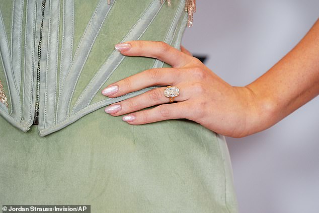 The Anti-Hero hitmaker, who is set to wed Kelce sometime this year, made sure to show off the massive diamond engagement ring on her left hand