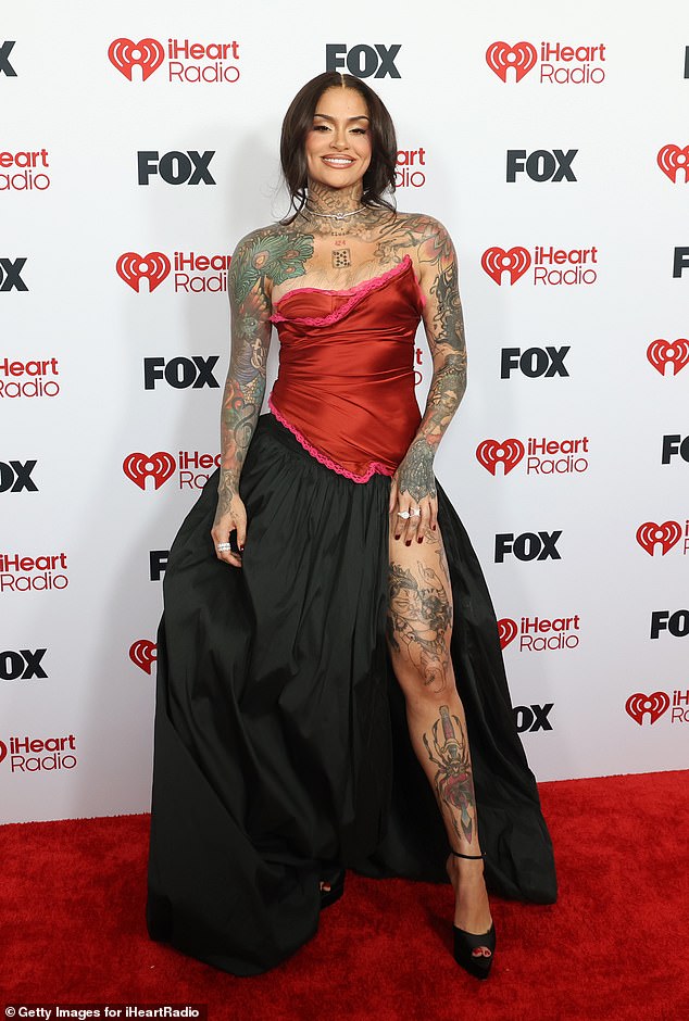 Kehlani, 30, showed off her impressive tattoo collection in a striking black and red ballgown