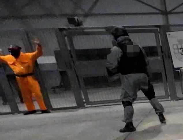 In another scenario, specialist officers were seen demonstrating the use of a Taser on a violent inmate