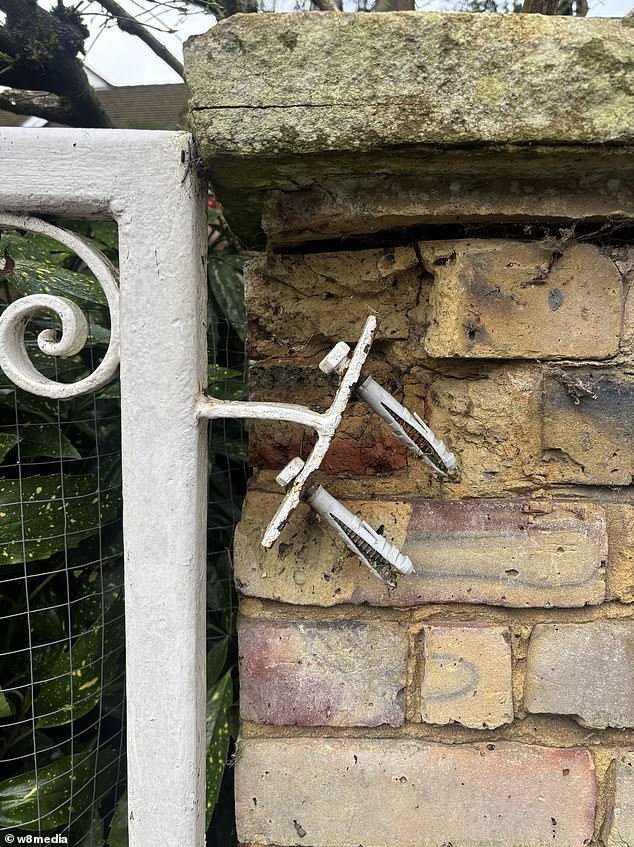 Signs of disrepair were apparent at Harris's house, including the front gate hanging off its hinges