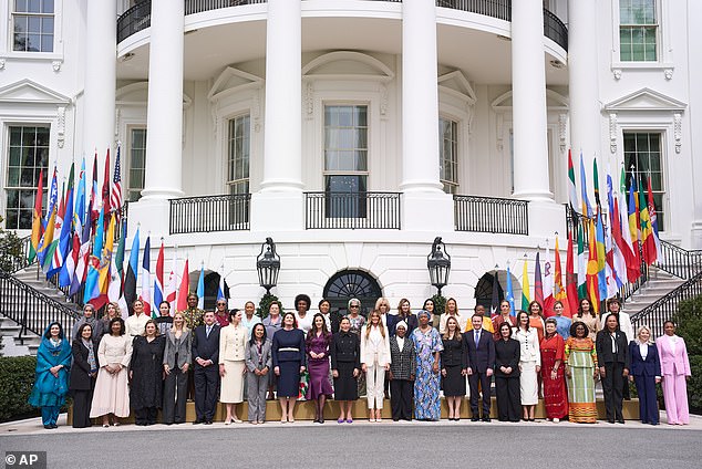 Pictured: First lady Melania Trump, center, and other first spouses pose for a group photograph after the 'Fostering the Future Together Global Coalition Summit,' at the White House