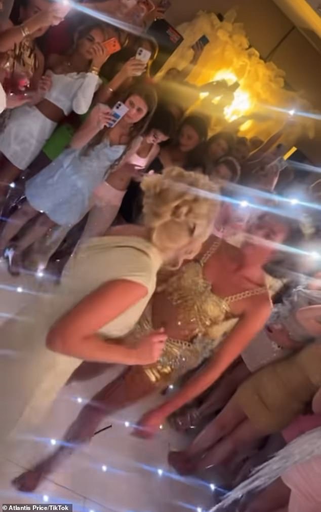 The video showed the bride to be following an outfit change, where she swapped her metallic gown for a co-ord for the rest of the night