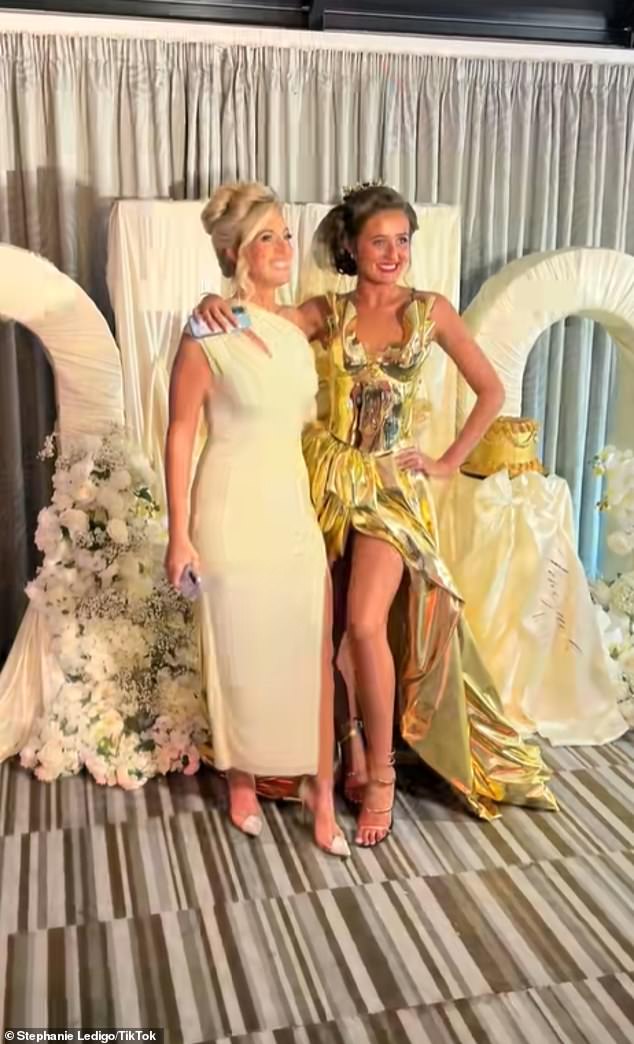 Venezuela wrapped an arm around her mother as they posed for photos