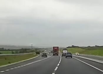 Watch idiot undertake lorry on slip road