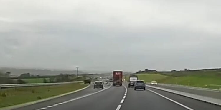 Watch idiot undertake lorry on slip road