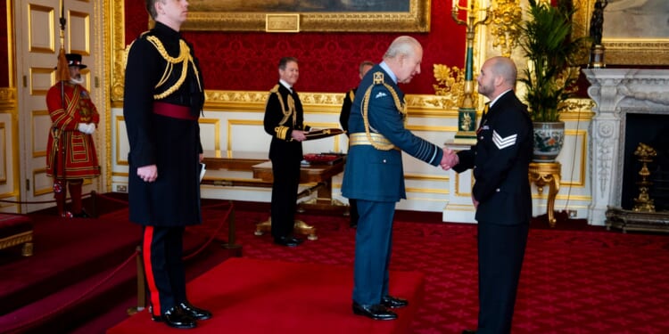 Cop repeatedly stabbed in NECK while trying to save colleagues in ambush by knife-wielding yob gets award