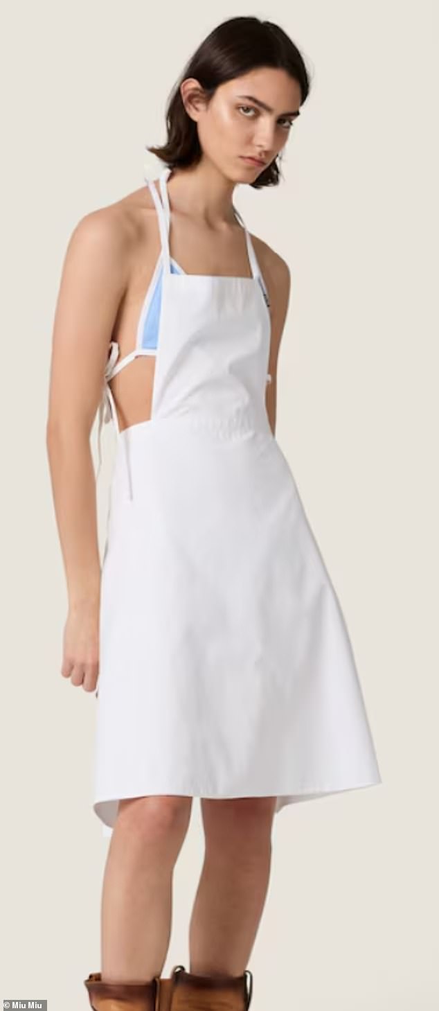 Other luxury clothing items on offer include a white Poplin apron (pictured) at £1,470 and Poplin pinafore dress at £2,100