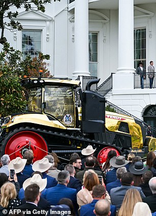 A gold tractor at a farmers event on the White House South Lawn