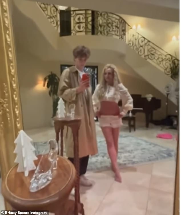 At one point she danced next to her son as he filmed them in a full-length mirror with a staircase behind them