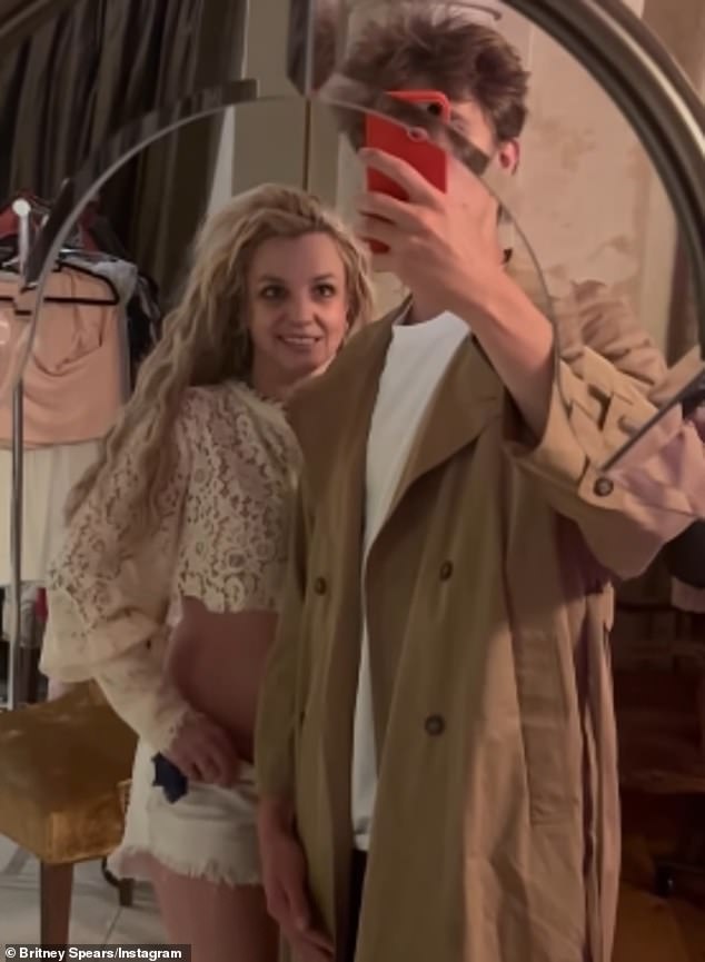 The star looked healthy in a lace shirt with cut-off shorts as she was seen in a video at home with one of her sons who wore a trench coat