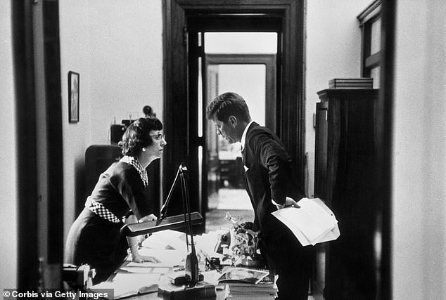 President John F. Kennedy gives directions to his secretary Evelyn Lincoln