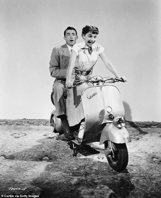 Audrey Hepburn and Gregory Peck pictured practicing a moped scene for the 1953 comedic romance Roman Holiday
