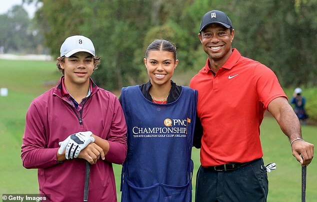 Woods pictured with his two kids Sam (center) and Charlie (left) in Florida in 2023