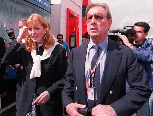 Another source says she's hiding at the Wiltshire home of her old flame Paddy McNally, now 88 (Pictured: The pair together at the British Grand Prix at Silverstone in 1997)