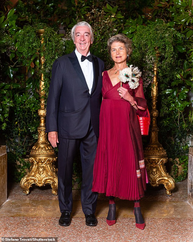 Freymond, 67, (pictured with his wife Caroline Freymond) will not, however, be facing justice. He was hit by a train and killed last July near the Swiss alpine village of Saanen