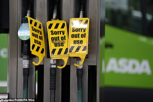 Petrol prices have hit their highest level for nearly two years and Mr Leighton warned that, thanks to the conflict raging in the Middle East, 'supply is tight'. Pictured: 'Out of use' signs on fuel pumps at an Asda petrol station in Clapham, south London on Friday