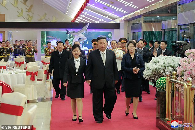 The imagery implies that Kim Ju-Ae (left) is equal to her father (centre), sometimes emphasised by her mother, Ri Sol-ju (right), walking behind them (Pictured) in 2023