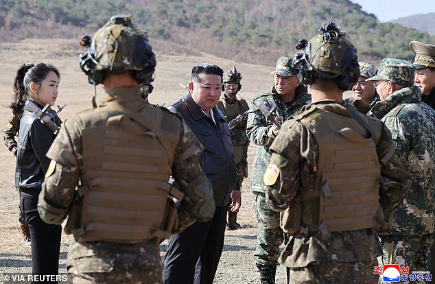 Pictured: Kim Ju-Ae and Kim Jong-Un speaking with troops during a tactical drill in Pyongyang earlier this month
