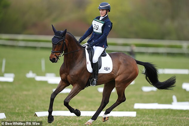 Princess Anne's daughter, 44, beamed as she took part in the equestrian event today, with her trusty steed Showtime