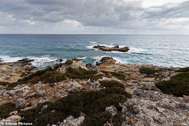 Pictured: The rocks where the three young people were found in Rhodes, Greece