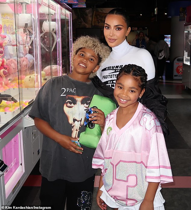 Kardashian also paused to take a snap with her son Saint and niece True, seven, as they took a look at the machines nearby