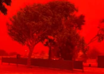 Terrifying moment sky turns blood red as cyclone tears through Australia knocking out power and gas as homes smashed up