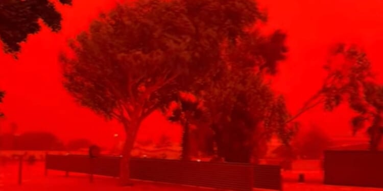 Terrifying moment sky turns blood red as cyclone tears through Australia knocking out power and gas as homes smashed up