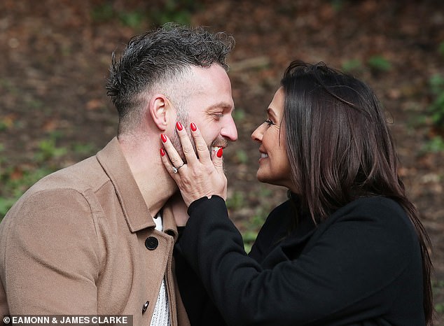 The couple took their dog for a stroll, with Kym wrapping up for the outing in a black coat which she wore with a matching turtle neck jumper