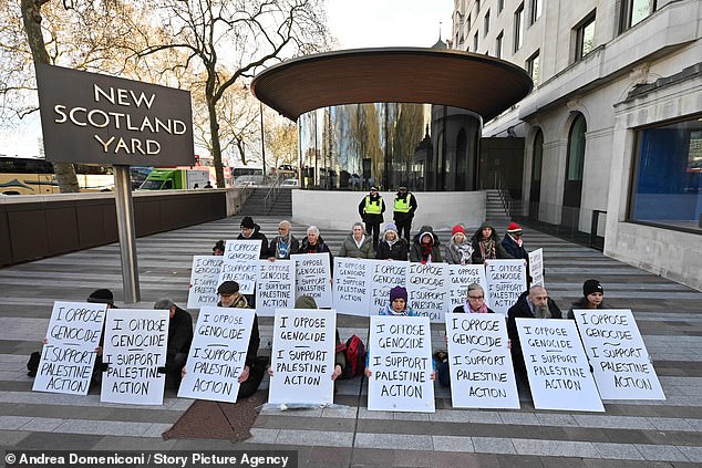 The Met said: '18 people are outside New Scotland Yard, where they are staging a protest in support of Palestine Action, which is a proscribed organisation under the Terrorism Act. Officers are present, and arrests will begin shortly'