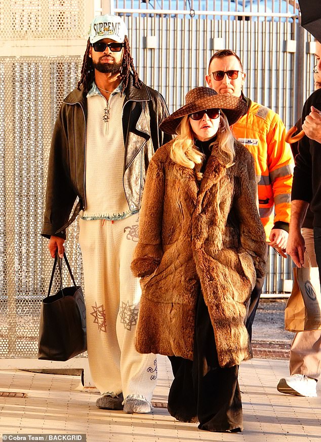 Letting her blonde locks fall loose down her shoulders, Madonna completed her look with a pair of sunglasses