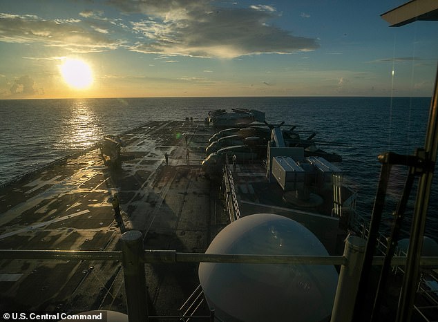 The USS Tripoli (pictured) is an amphibious assault ship. The USS Boxer and two other ships, along with another Marine Expeditionary Unit, have also been ordered to the region from San Diego