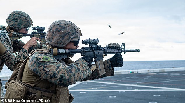 At least 13 US military personnel have died in the Iran conflict so far and that number would be poised to rise dramatically if soldiers are deployed on the ground. Marines are pictured during a training exercise aboard the USS New Orleans