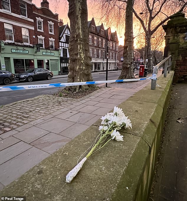 Flowers left at the scene this morning after it was confirmed seven people were injured