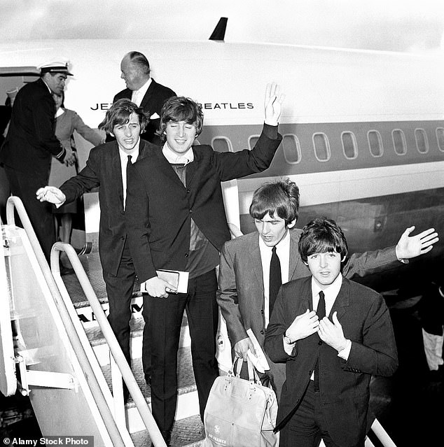 The Beatles board their plane at Heathrow airport for their tour of America in 1964. L-R: Ringo Starr, John Lennon, George Harrison and Sir Paul McCartney