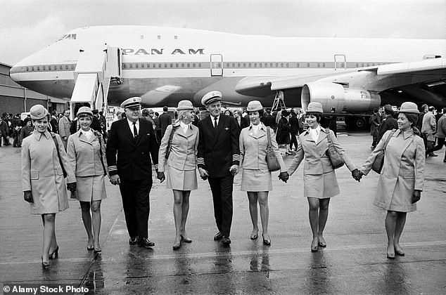 Pictured: This image shows the captain and crew of the first Boeing 747 to land on British soil walking away from the Pan-Am jumbo jet