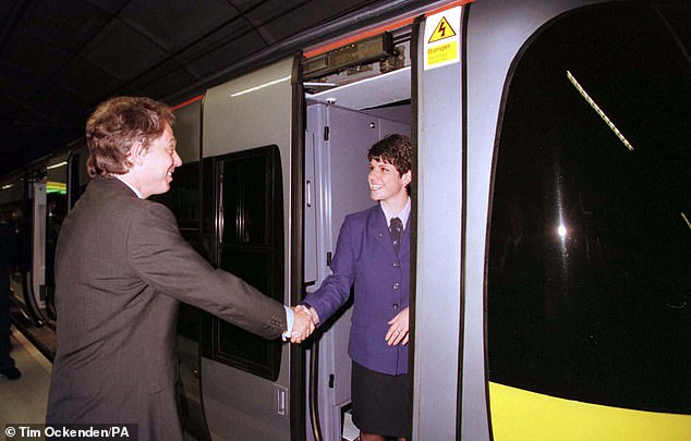 Prime Minister Tony Blair speaks to Claire Pick, the driver of the Heathrow Express train which he travelled on when he officially opened Heathrow Express