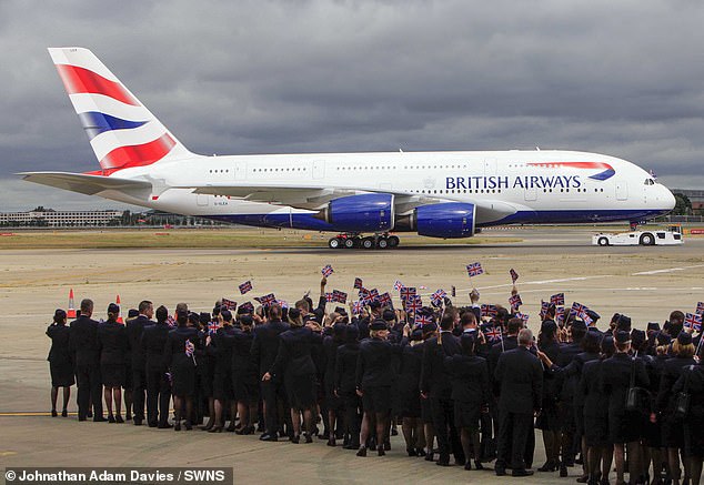 BA staff greet the Airbus A380 at Heathrow Airport as British Airways takes delivery of the new double-decker, the world's largest commercial jet