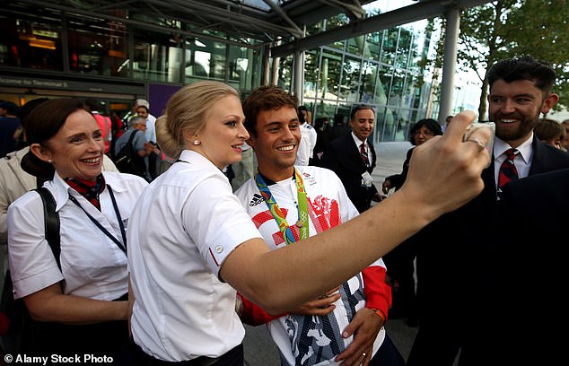 Team GB's Tom Daley poses for pictures at Heathrow Terminal 5 after arriving home from the Olympics in Rio de Janeiro, Brazil, in 2016