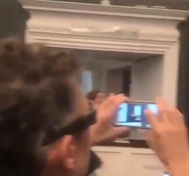 Caught gleefully videoing the artwork being shredded, this man bears an uncanny resemblance to Gunningham. Shortly afterwards, the artist posted a photo of the shocked crowd at Sotheby's on Instagram with the words 'Going, going, gone...