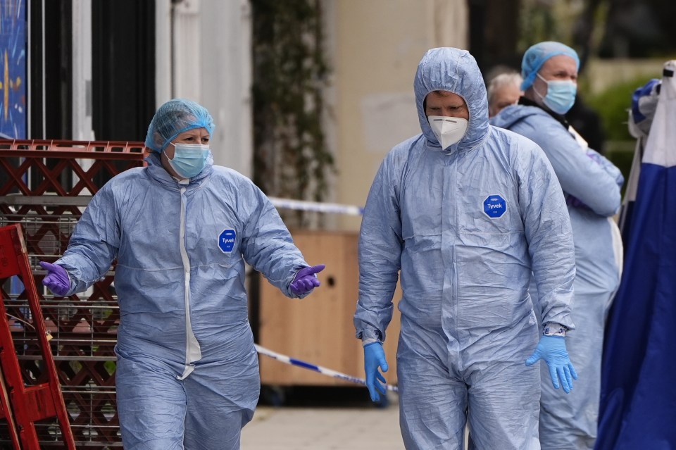 Forensic investigators at a crime scene on Chalton Street.