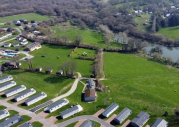 Locals at war with looming 'eyesore' caravan park that 'lights up like Blackpool & means they can't use their HOT TUBS'