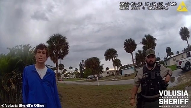Cruz was being read his Miranda rights by a Volusia County deputy and Daytona Beach Shores cop when he bolted towards the Halifax River. He is shown seconds before he sprinted away