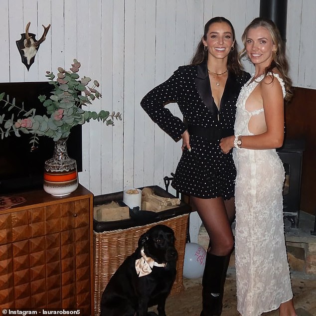 Boulter posed alongside Robson and a dog, who was wearing a bow tie, with other decorations also visible