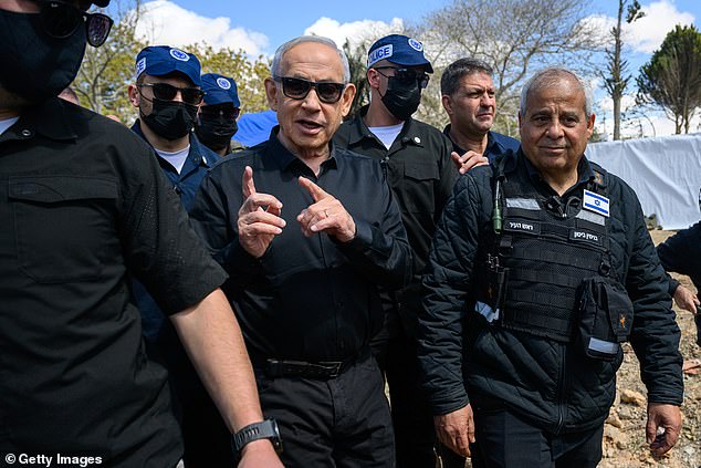 The sketch, drawn by cartoonist Sean Delonas, depicted Netanyahu (pictured on March 22 at the site where an Iranian ballistic missile struck) with an overly large nose while dining at a blood-covered table surrounded by bags of money