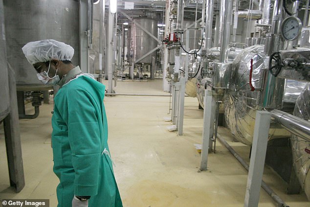The underground nature of facilities like Isfahan makes accessing uranium stockpiles particularly difficult for any external force. Pictured, a worker walks inside of an uranium conversion facility at Isfahan in 2005
