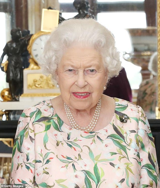 Queen Elizabeth is photographed wearing the brooch (right side) that was gifted to her by First Lady Michelle Obama as President Donald Trump arrived in the United Kingdom for their first meeting