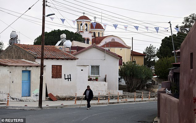A man walks in Akrotiri village next to RAF Akrotiri, a British sovereign base in Cyprus