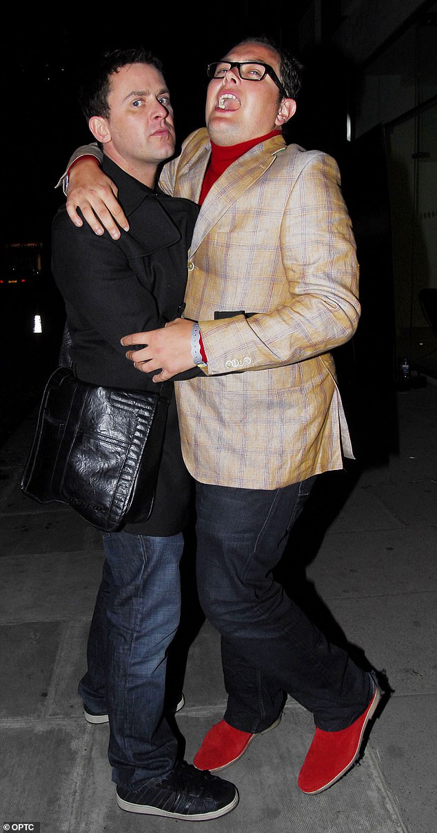 Mills is pictured enjoying a boozy night out with Alan Carr in 2009