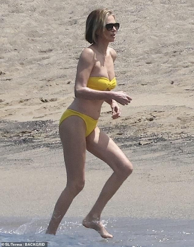 The 50-year-old thespian was pictured enjoying the ocean while in a canary yellow bikini